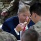 President Donald Trump eating with members of the military in a dining facility during a surprise Thanksgiving Day visit, Thursday, Nov. 28, 2019, at Bagram Air Field, Afghanistan.